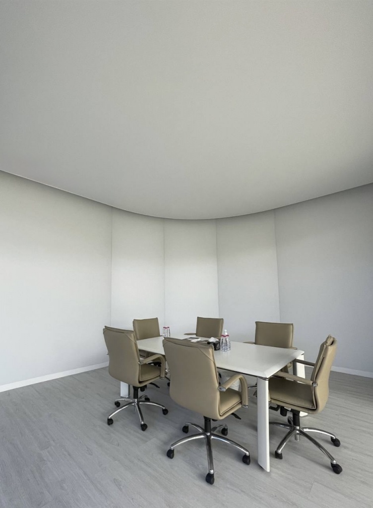 Fully illuminated translucent office meeting room with integrated dimmable LED lighting and modern architectural design. Fully illuminated translucent office meeting room with integrated dimmable LED lighting and modern architectural design.