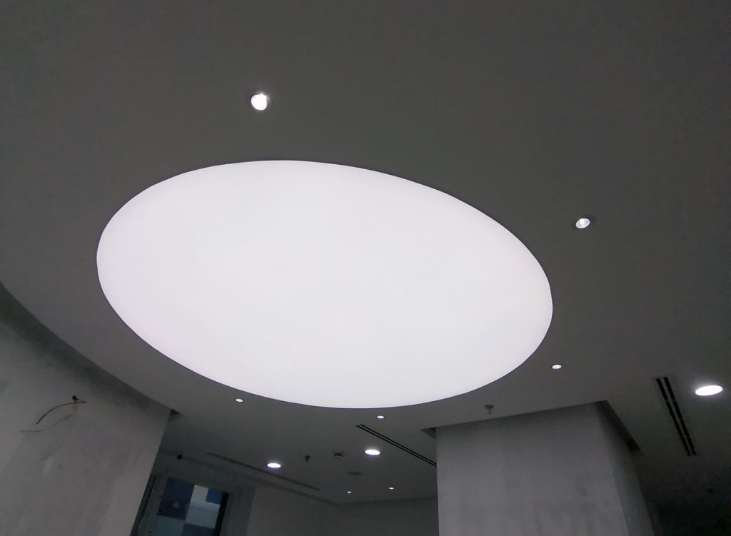 Suspended geometric light boxes with integrated architectural lighting installed in a premium hospitality interior in the UAE. Suspended geometric light boxes with integrated architectural lighting installed in a premium hospitality interior in the UAE.