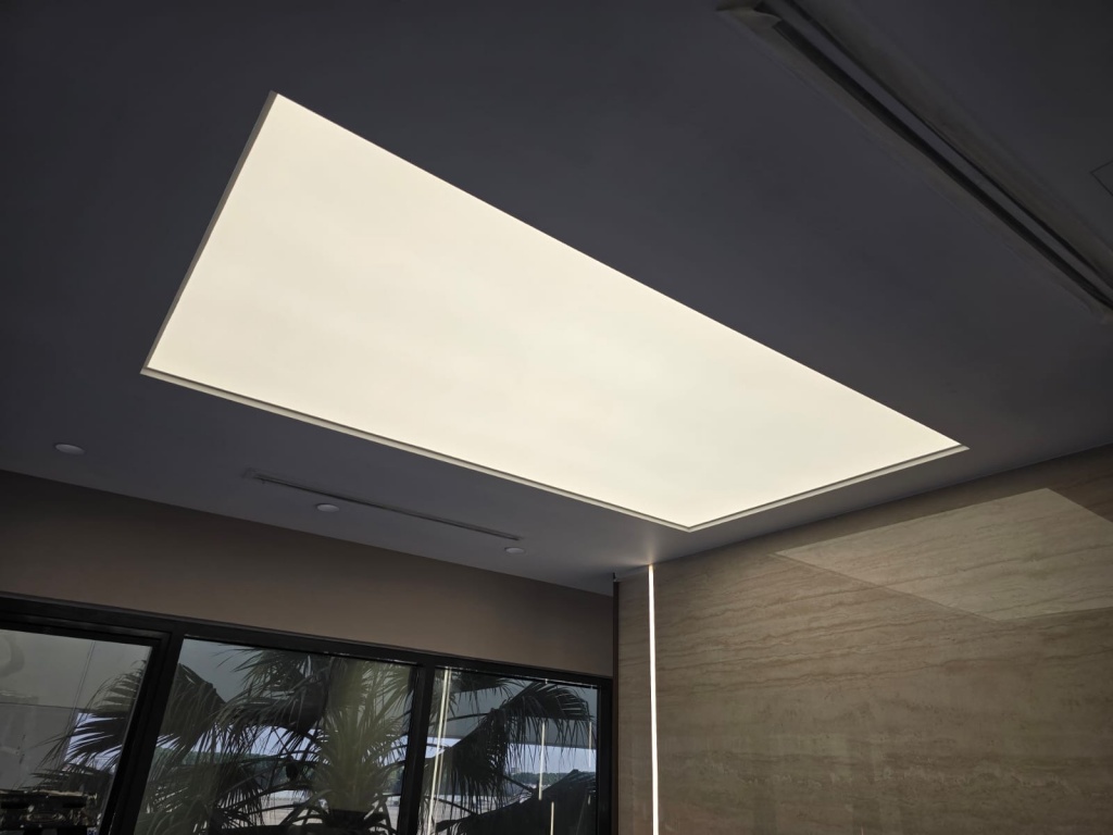Modern 4000K illuminated stretch ceiling with uniform LED lighting in a luxury Qatar interior project. Modern 4000K illuminated stretch ceiling with uniform LED lighting in a luxury Qatar interior project.