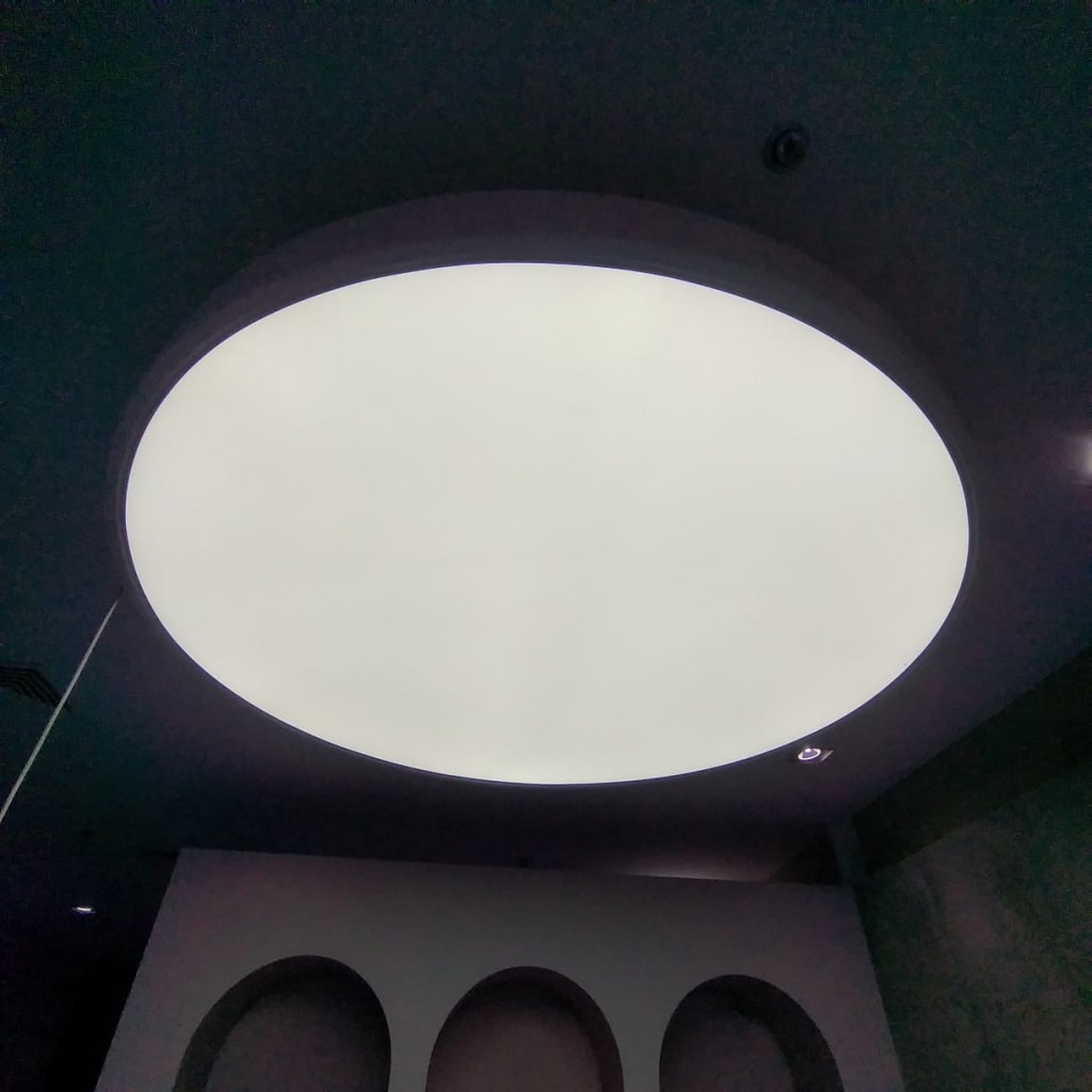 Large recessed light ceiling with translucent stretch membrane and integrated LED system in a contemporary office interior in Dubai. Large recessed light ceiling with translucent stretch membrane and integrated LED system in a contemporary office interior in Dubai.