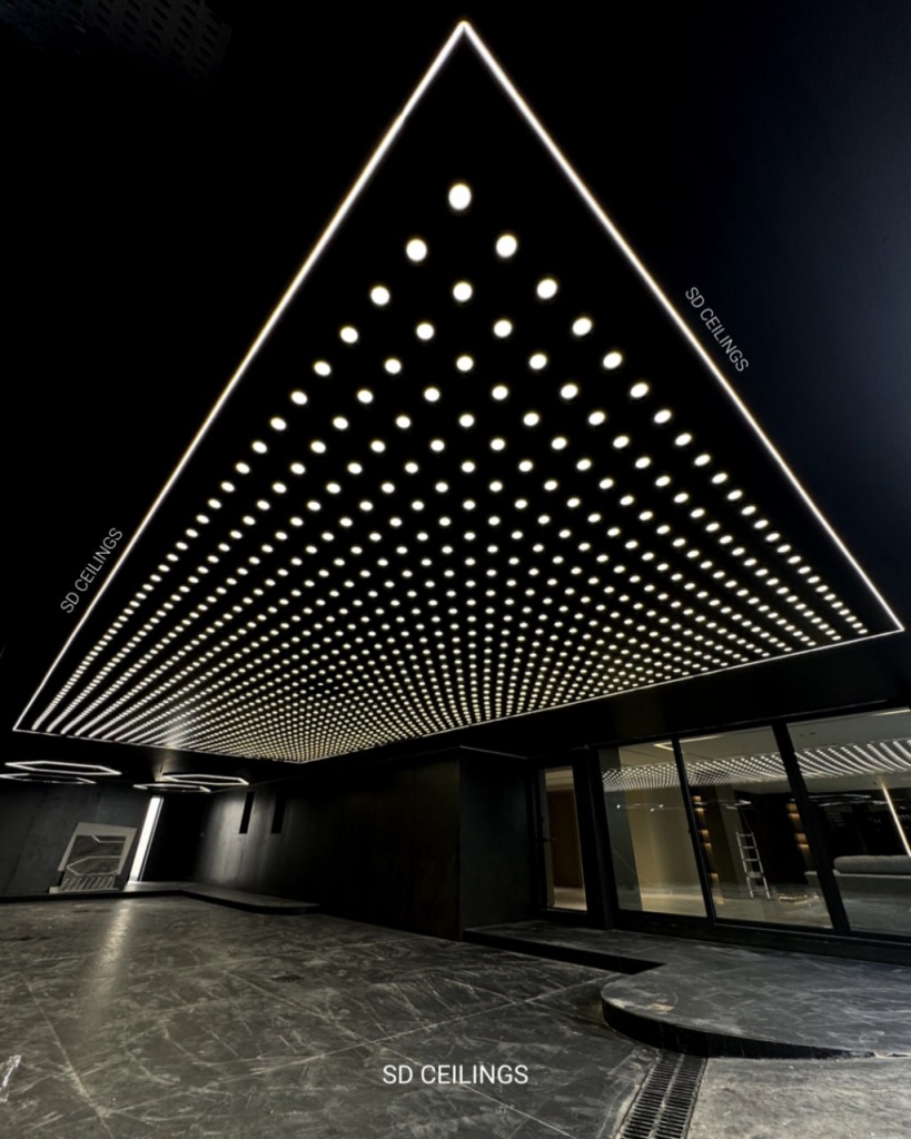 The double layer stretch ceiling system not only offers visual appeal but also provides functional benefits. It helps to improve sound insulation, reduce energy consumption by optimizing light diffusion, and hide unsightly wires, pipes, or imperfections in your original ceiling. Additionally, the optional integration of backlighting between the layers creates a soft, ambient glow, perfect for setting the mood in residential, commercial, or hospitality environments.