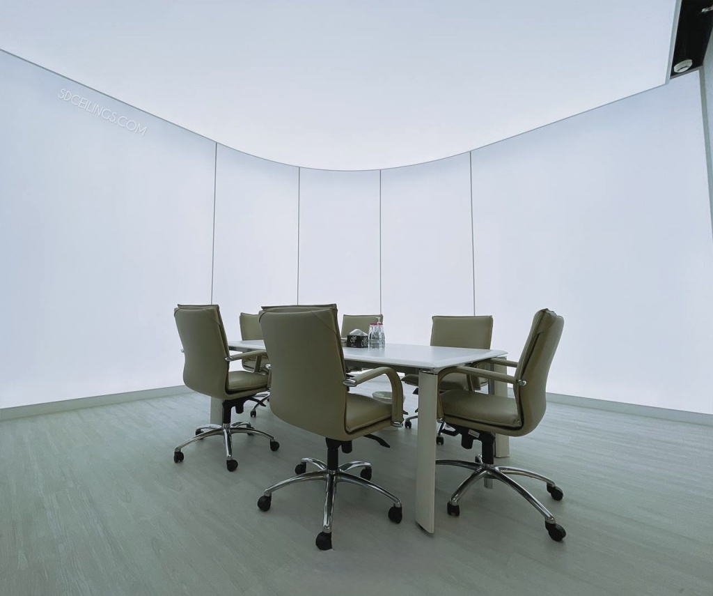Modern translucent meeting room with illuminated stretch ceiling and walls featuring dimmable 6500K LED lighting in Sharjah. Modern translucent meeting room with illuminated stretch ceiling and walls featuring dimmable 6500K LED lighting in Sharjah.