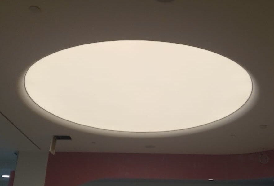 Elegant translucent stretch ceiling with neutral white LED illumination for a contemporary commercial space in Qatar. Elegant translucent stretch ceiling with neutral white LED illumination for a contemporary commercial space in Qatar.