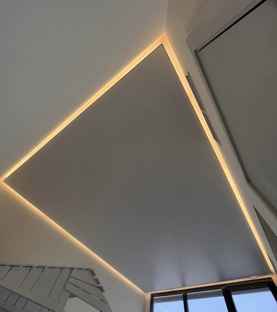 Backlit stretch ceiling lighting design in Dubai – clean and glare-free illumination integrated into ceiling architecture Backlit stretch ceiling lighting design in Dubai – clean and glare-free illumination integrated into ceiling architecture