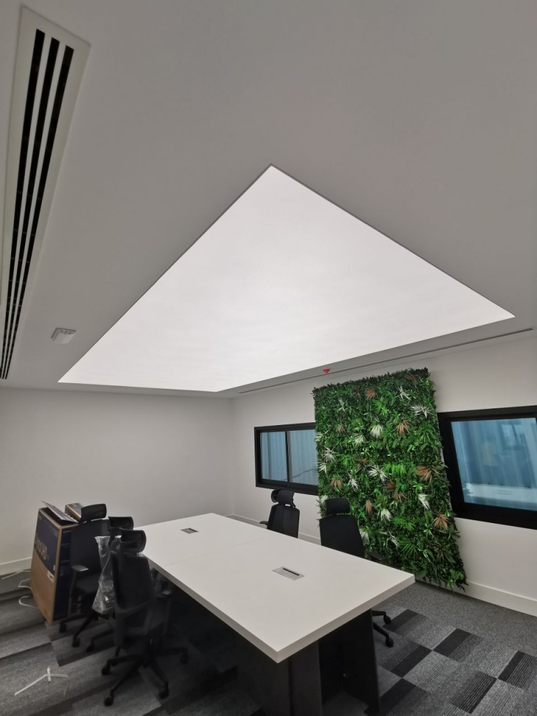 Professional repair of a modern stretch ceiling system with integrated LED lighting in a luxury Dubai interior. Professional repair of a modern stretch ceiling system with integrated LED lighting in a luxury Dubai interior.